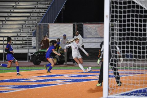 Senior Siera Herbert attempts to shoot the ball into the goal for Perry against Westwood. Herbert is a role model for her younger sister in the program and she worked to demonstrate good worth ethic for her sister.