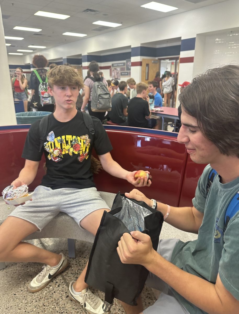 Senior Evan Magana (Left) Converses with senior Hudson Palevsky (Right). This area of the lunchroom is one of the most prominent renovations, with the long S shaped tables.