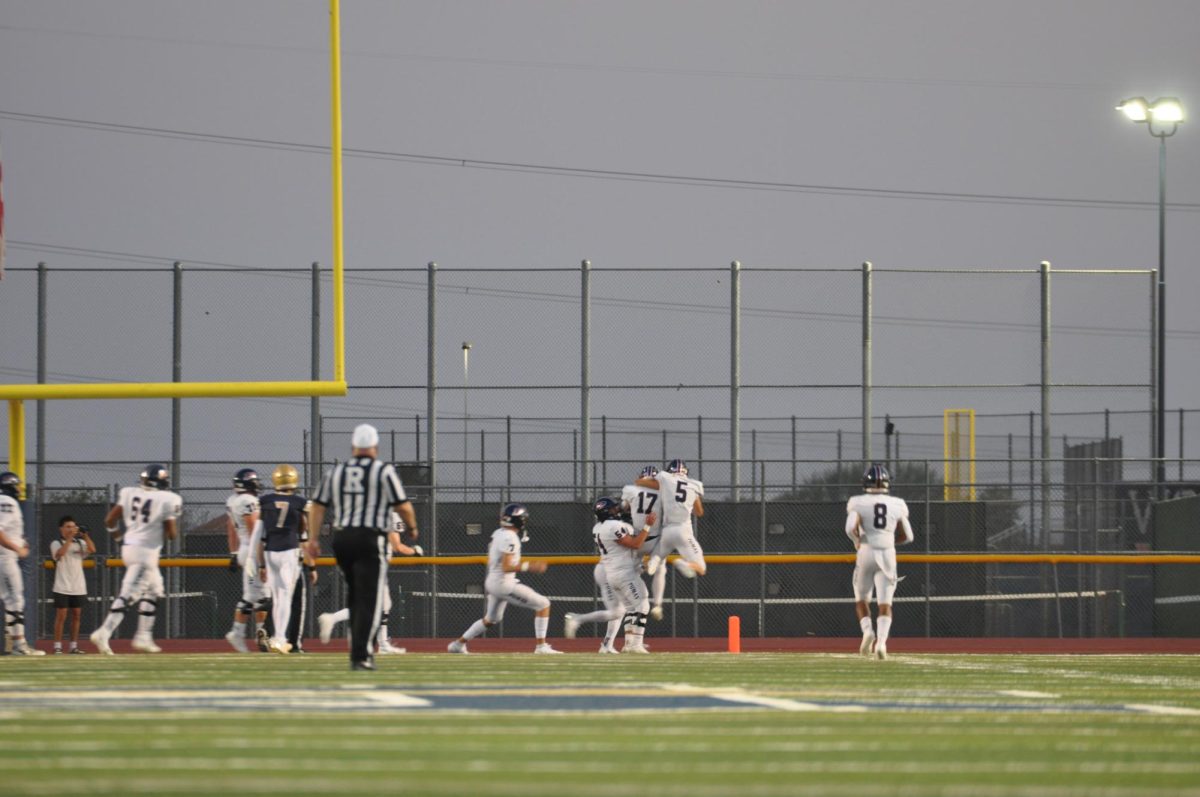 Junior wide receiver Hayden Moon (#17) and senior wide receiver Jaden Barth (#5) celebrate a touchdown reception by Moon. The team was ready for the away game, as Moon stated, “[An away game] definitely motivates us more, it’s always more fun to go out and get a road win.”