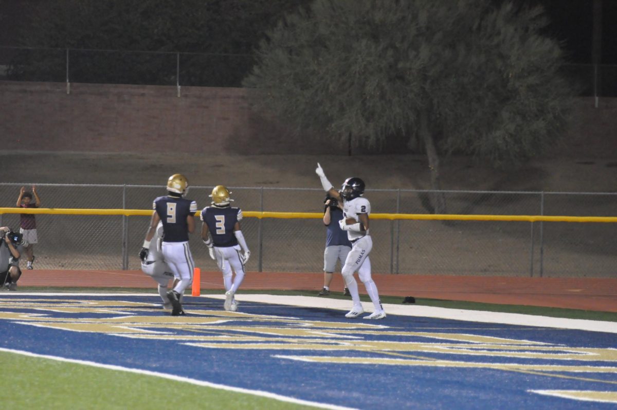 Senior wide receiver Kolton Coleman points to the sky in celebration after a receiving touchdown. Wide receivers were making plays all game on offense, including multiple receiving touchdowns. 