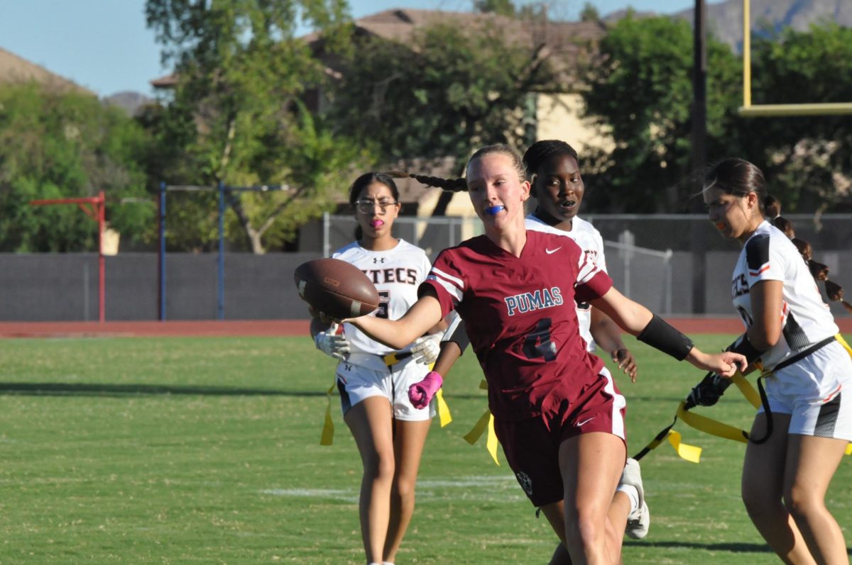 Sophomore Kendal Conner attempting to pass the football to another teammate. The team lost 6-26 against Corona del Sol.