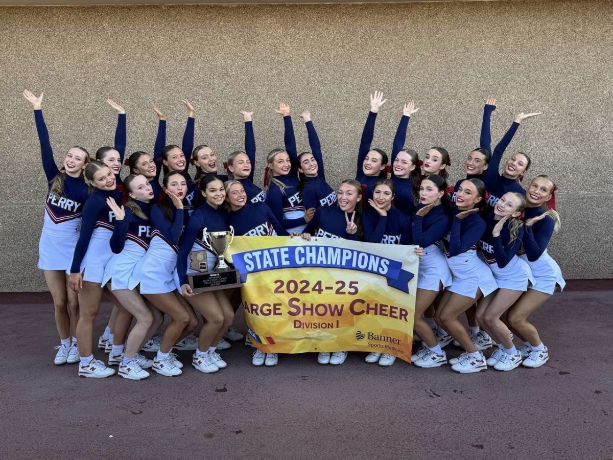 Varsity cheer team celebrates their win as state champions in the Division l Show Cheer category. After months of preparation varsity cheer has brought home multiple titles all of which are state level wins for their last competition.
