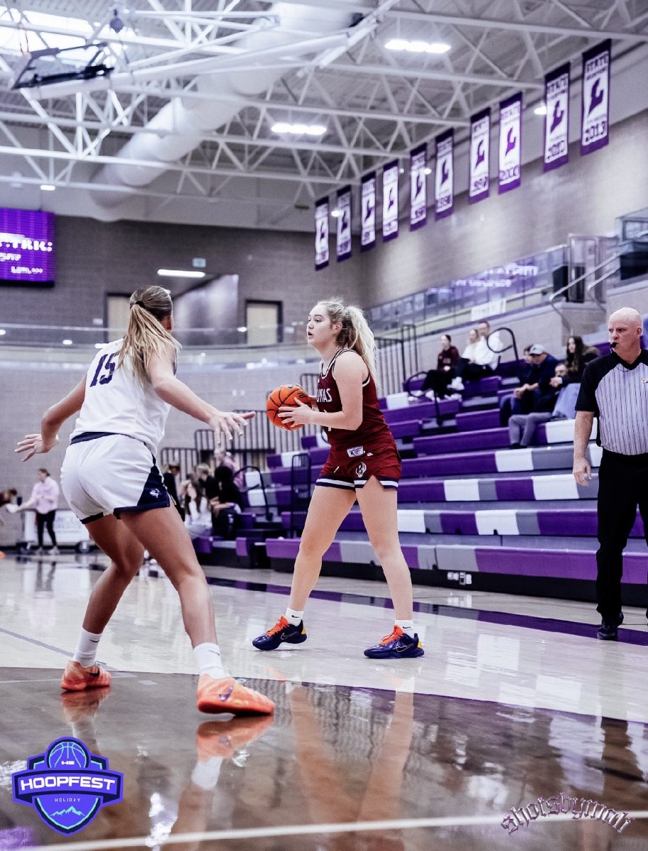 Senior shooting guard Novelle McQuiston sets up for a pass during the Holiday
Hoopfest tournament against Ridgeline High School. Perry won 60-45 in the
game.
