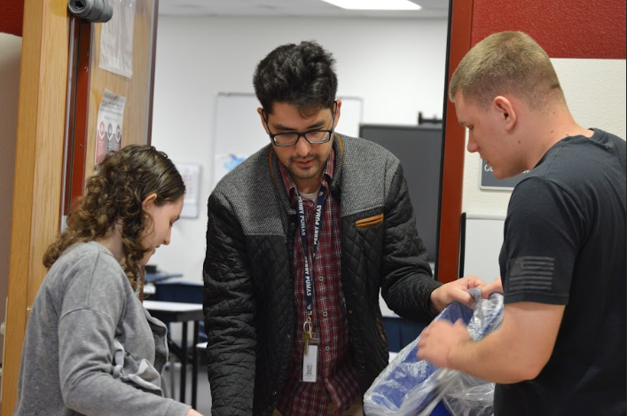 Peter Ting teaching students recycling methods.