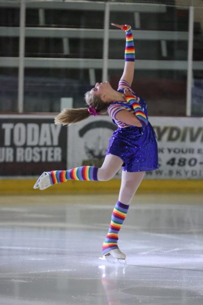 Senior Kate Wilson skates on the ice during competition. Wilson hopes to become a professional skater after graduation and dreams of performing with Disney on Ice.